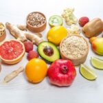 Salad with avocado, beetroot and sesame seeds on a dark background ...
